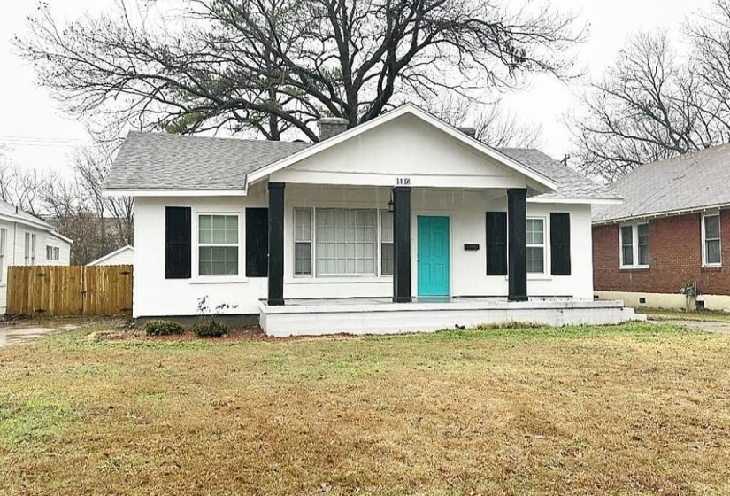 View of front of house with a front lawn and a porch