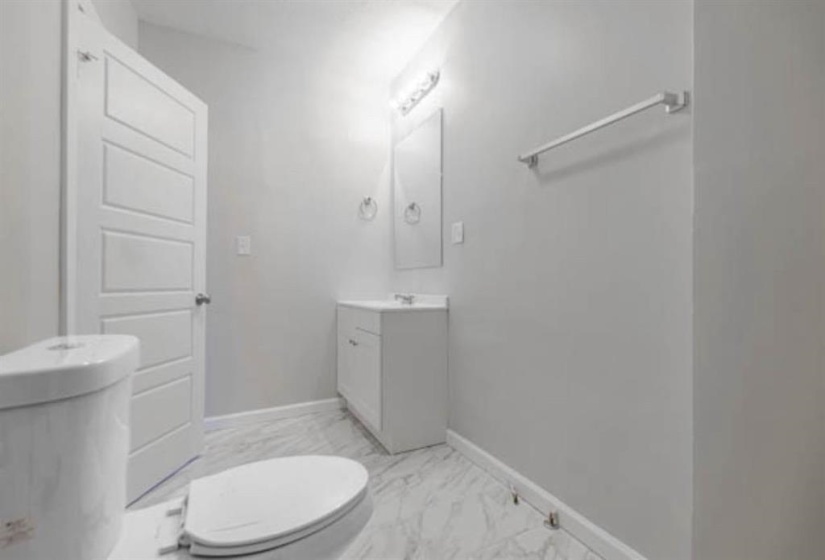 Bathroom with vanity and toilet