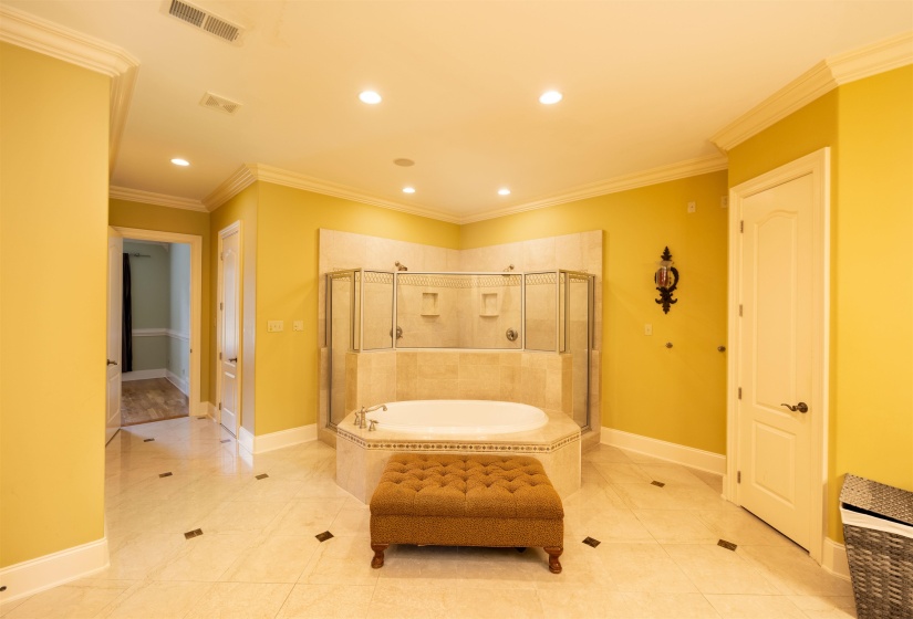 Bathroom with a garden tub, recessed lighting, ornamental molding, a shower stall, and tile patterned floors