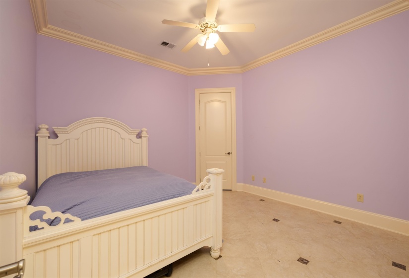 Bedroom with crown molding and ceiling fan