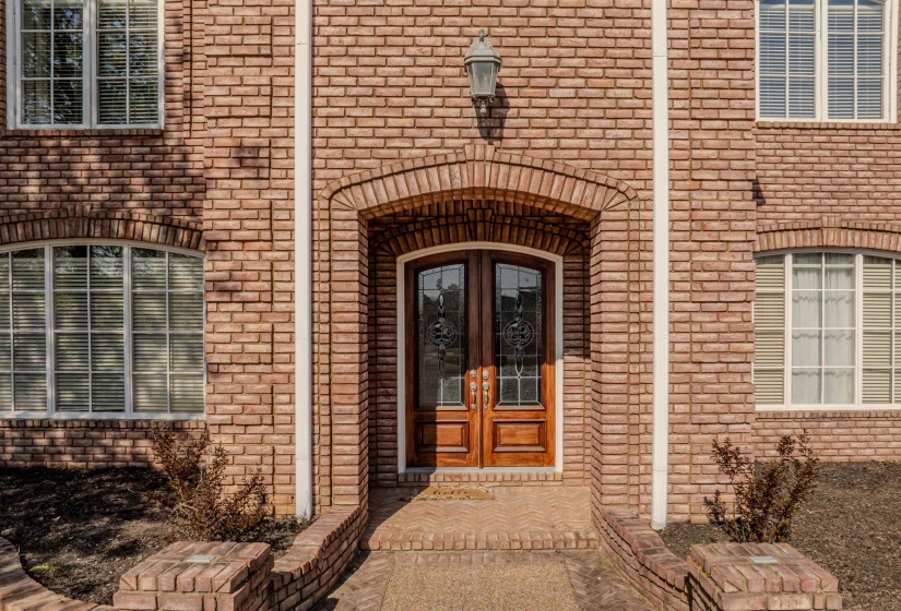 Doorway to property with brick siding and french doors