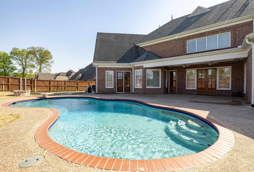 View of swimming pool with a fenced backyard, a patio area, a fenced in pool, and french doors