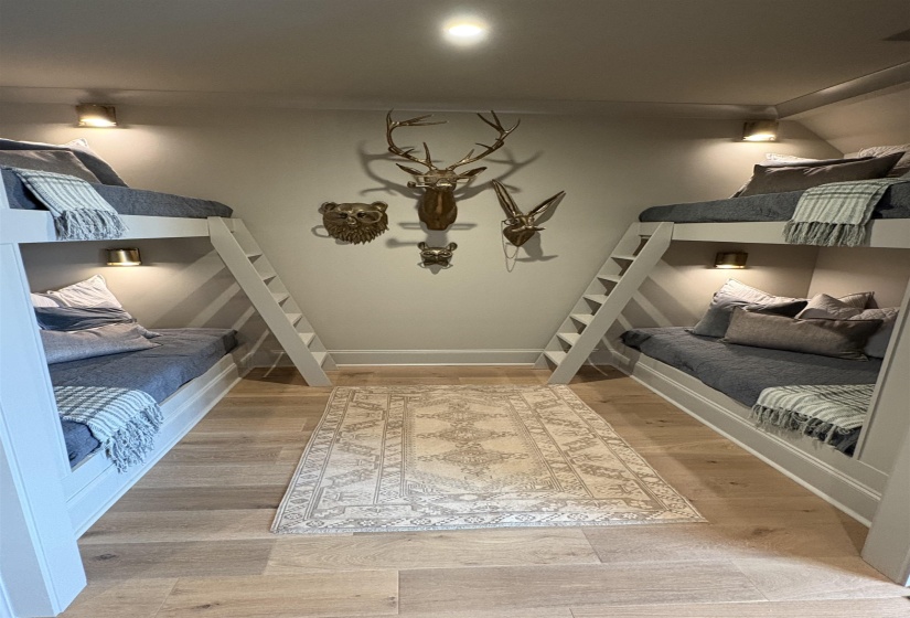 Bedroom featuring wood finished floors and baseboards