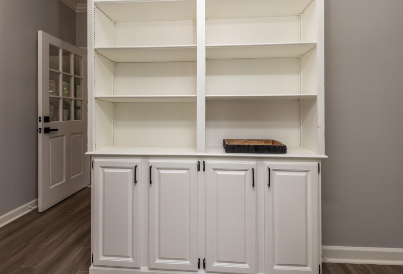 Room details featuring baseboards and wood finished floors