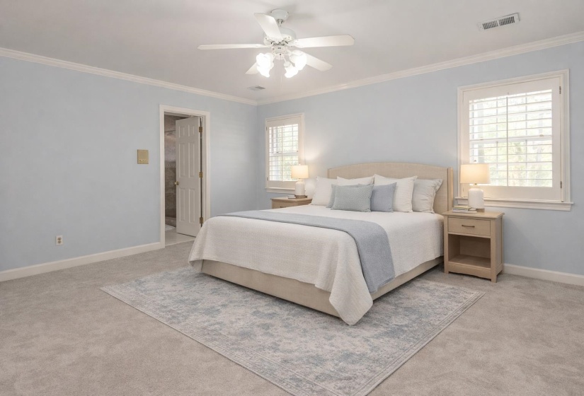 Bedroom featuring crown molding, light carpet, and ceiling fan