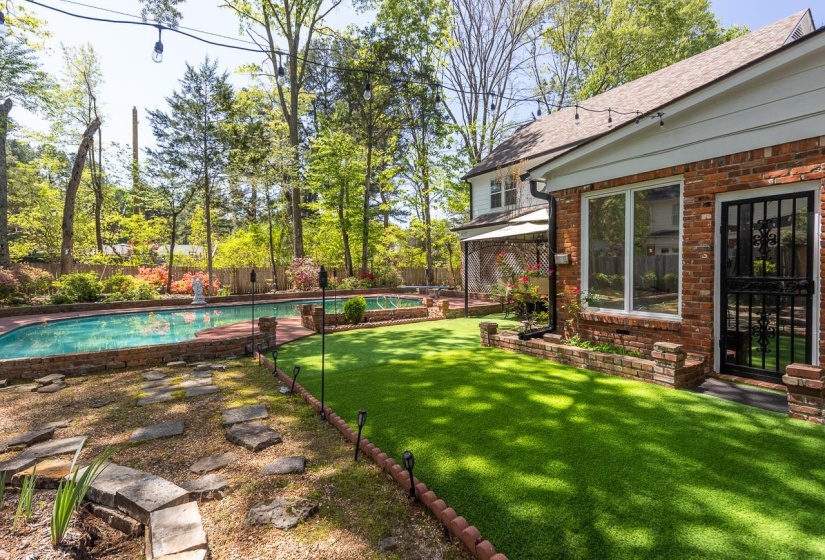 Fenced backyard with a patio area