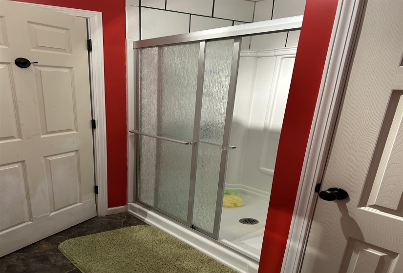 Bathroom featuring a shower stall Bathroom featuring a shower stall