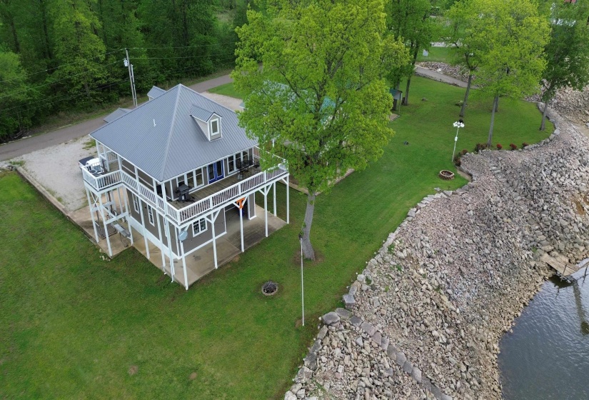 Birds eye view of property with a water view Birds eye view of property with a water view