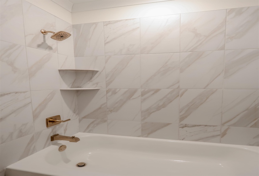 Full bath featuring bathtub / shower combination