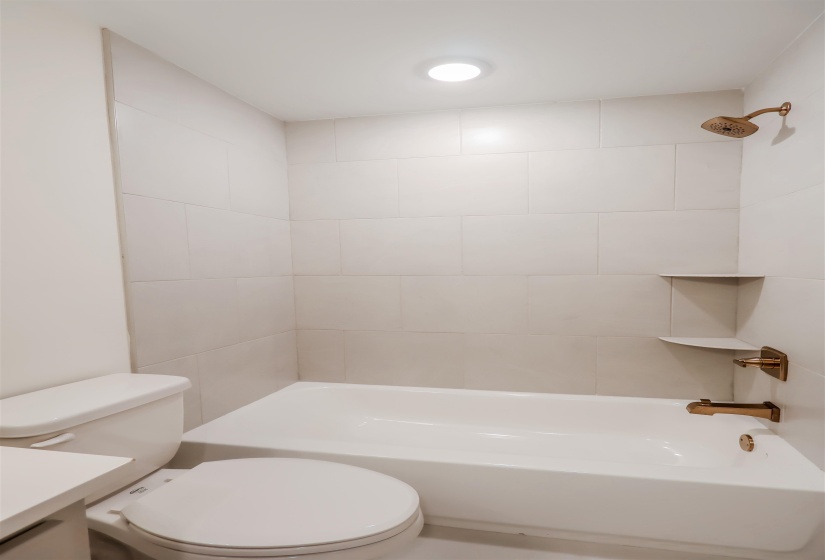 Bathroom featuring bathing tub / shower combination and vanity
