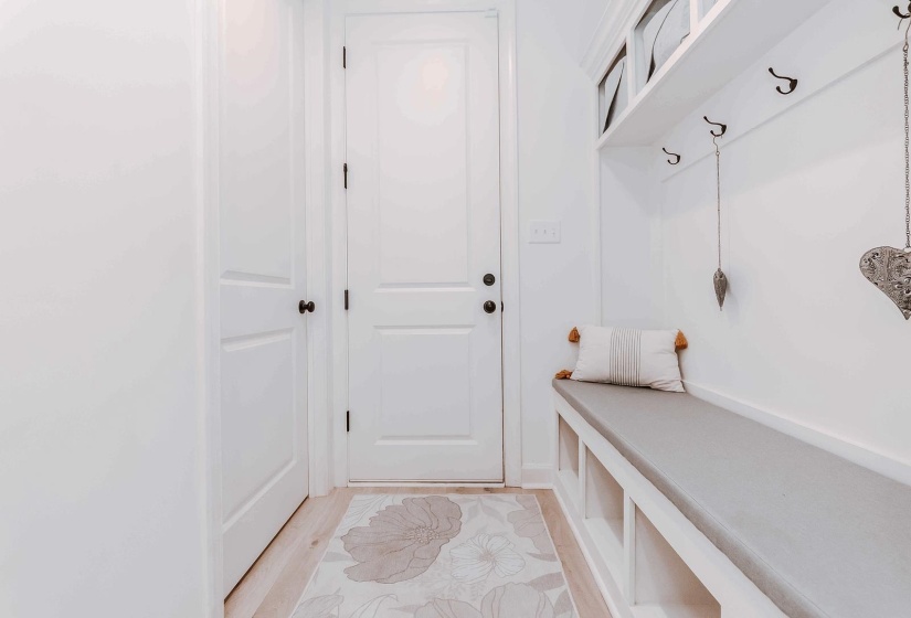 Mudroom with light wood finished floors