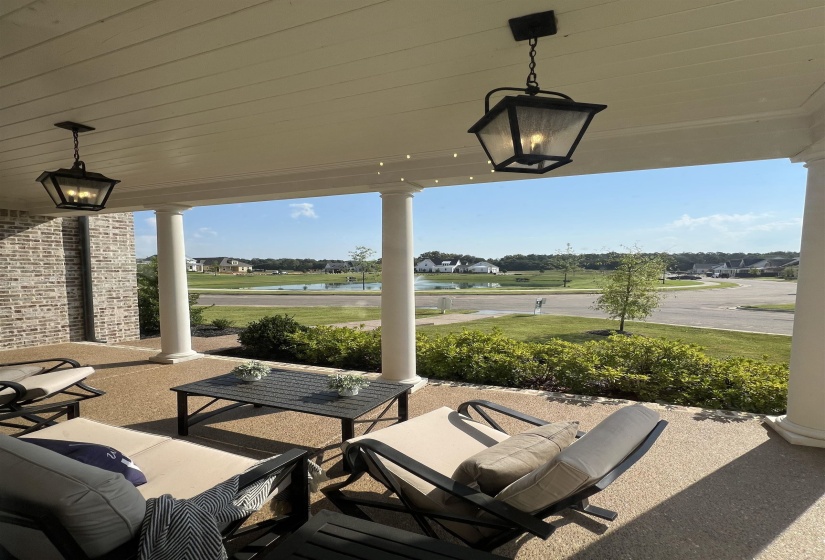 View of patio / terrace featuring a water view