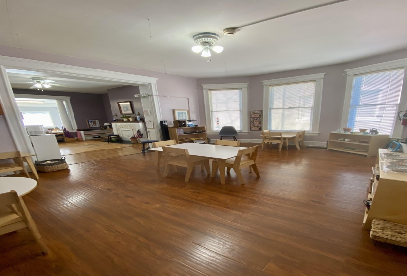 Dining area with a ceiling fan and wood finished floors