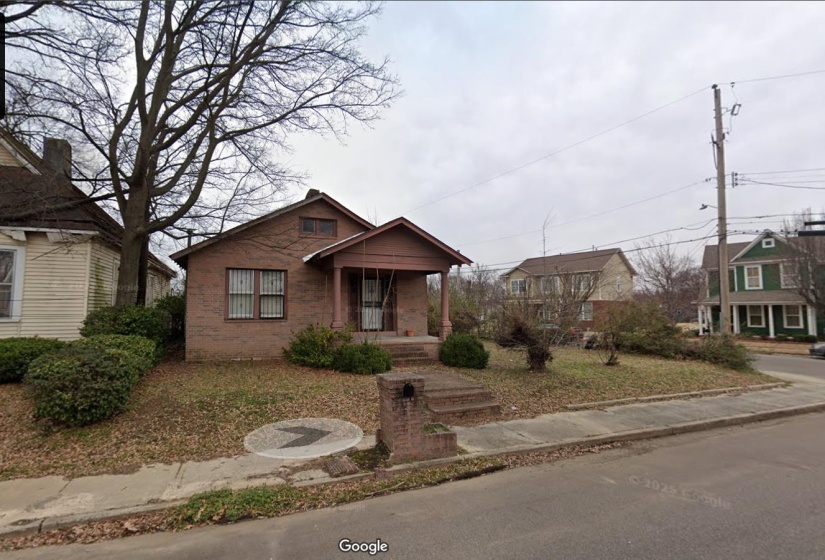 Bungalow featuring a porch and brick siding