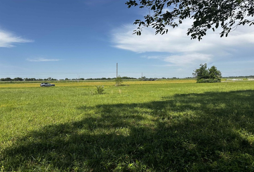 View of yard with a rural view