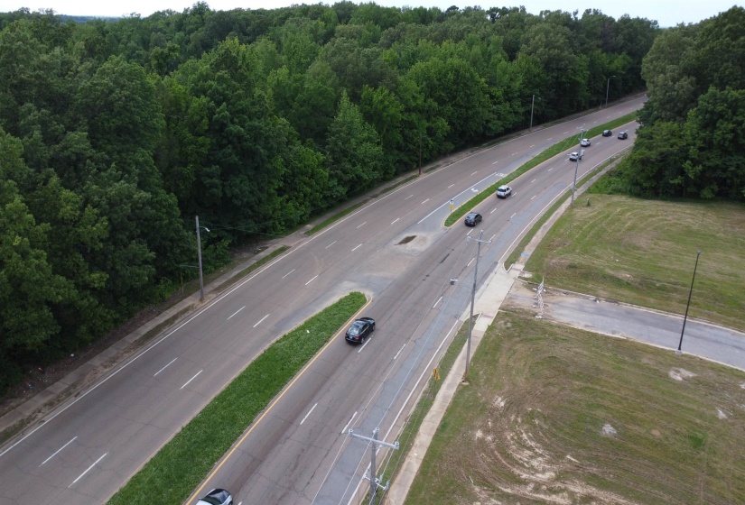 Birds eye view of property with a forest view