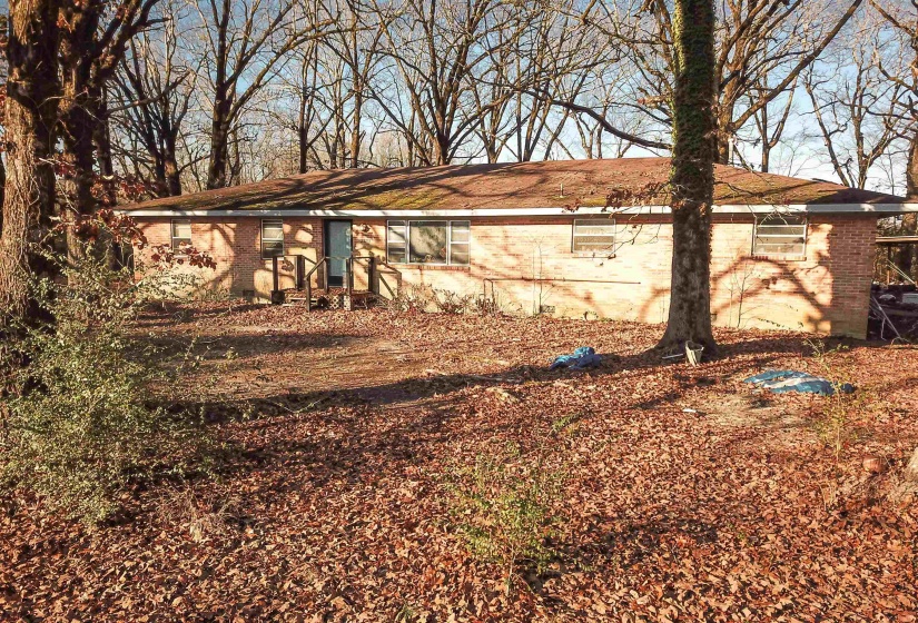 View of property exterior featuring brick siding