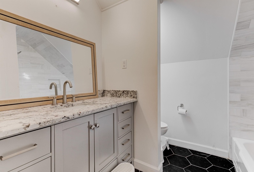 Full bath with baseboards, tile patterned flooring, a tub to relax in, vanity, and a shower