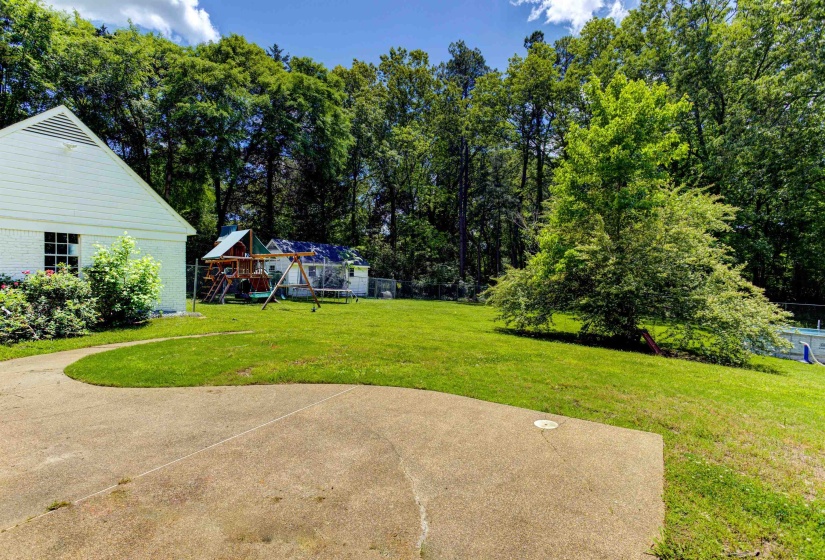 View of grassy yard with a playground