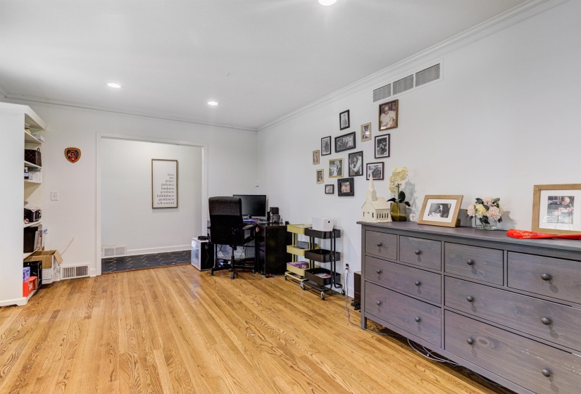 Office space featuring ornamental molding, light wood-style flooring, recessed lighting, and baseboards