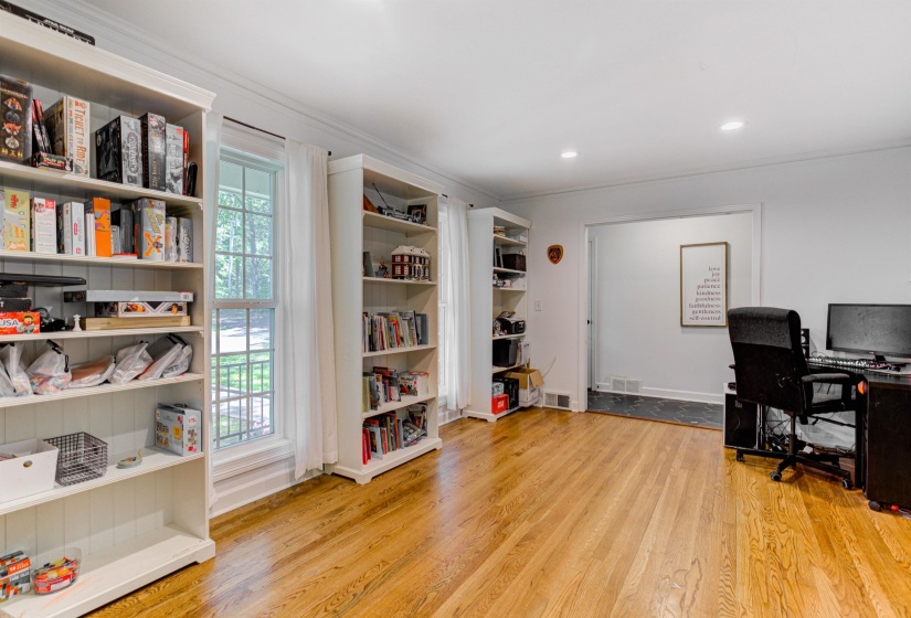 Office area with wood finished floors, crown molding, and recessed lighting