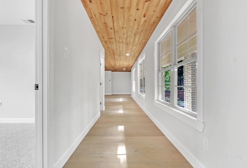 Hall with wooden ceiling, recessed lighting, light wood-style floors, and baseboards