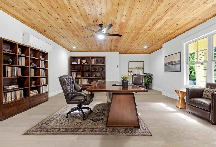 Office space featuring wood ceiling, a ceiling fan, baseboards, and light wood finished floors