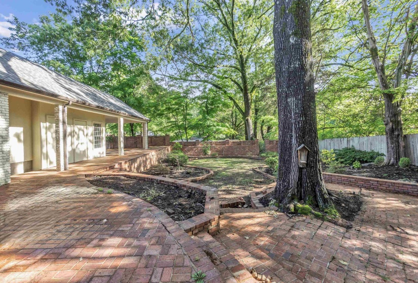 Fenced backyard with a patio