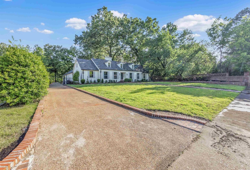 Cape cod-style house with a front lawn