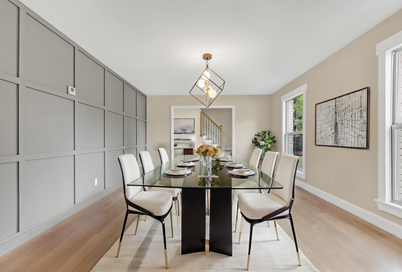 Dining room with light wood-type flooring and baseboards