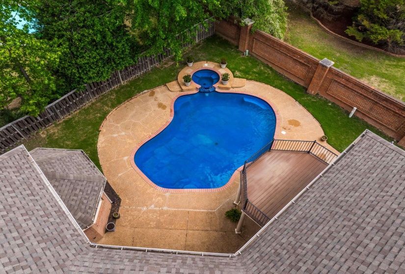 View of pool featuring a fenced backyard, a patio area, and a pool with connected hot tub