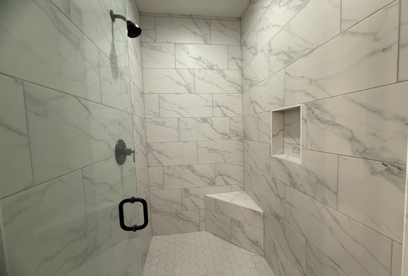 Full bathroom with a stall shower