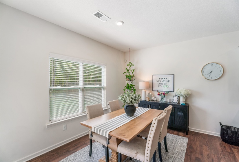 Dining area featuring baseboards and wood finished floors