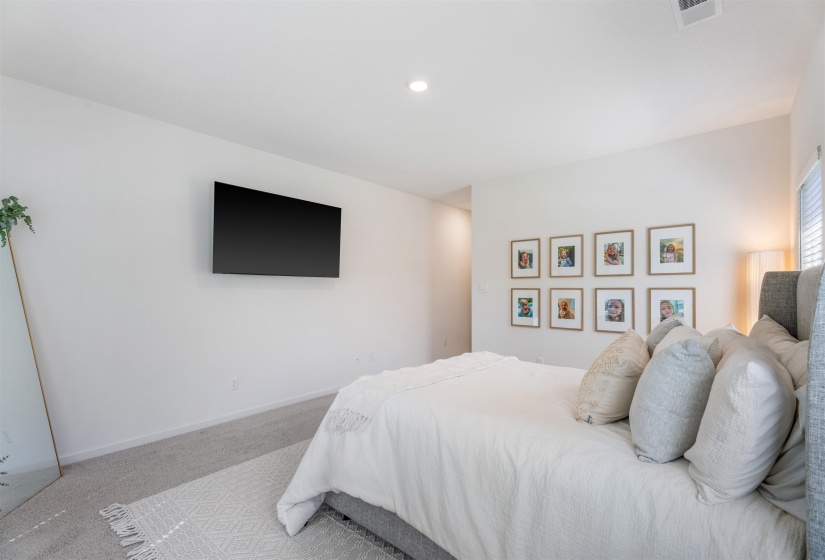 Bedroom with carpet and baseboards