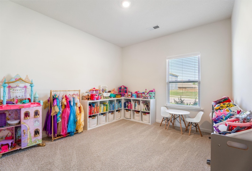 Rec room with carpet and baseboards