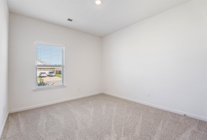 Carpeted empty room with baseboards