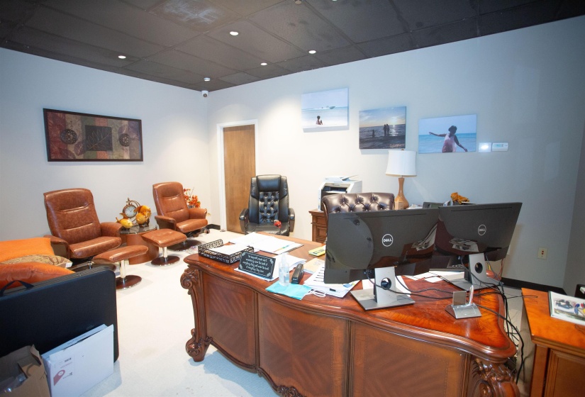 Home office featuring a drop ceiling