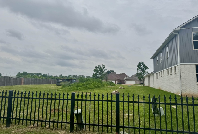 View of yard. Zero lot  Gated Community