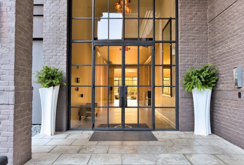 Entrance to property with brick siding and french doors