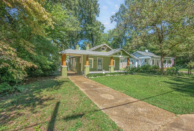 View of front facade with a porch and a front lawn