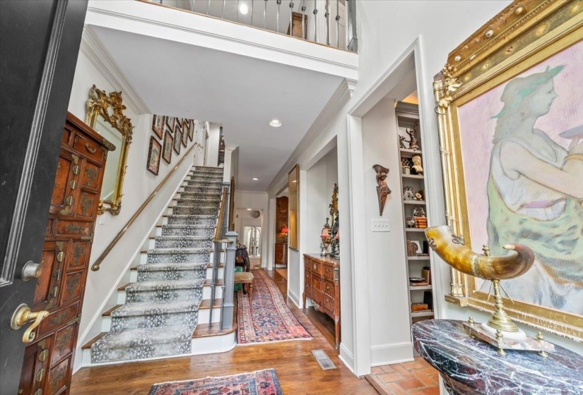 Foyer entrance featuring stairs, baseboards, ornamental molding, and recessed lighting
