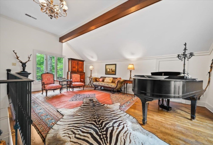 Above the kitchen & Keeping room is a private lofted Music studio