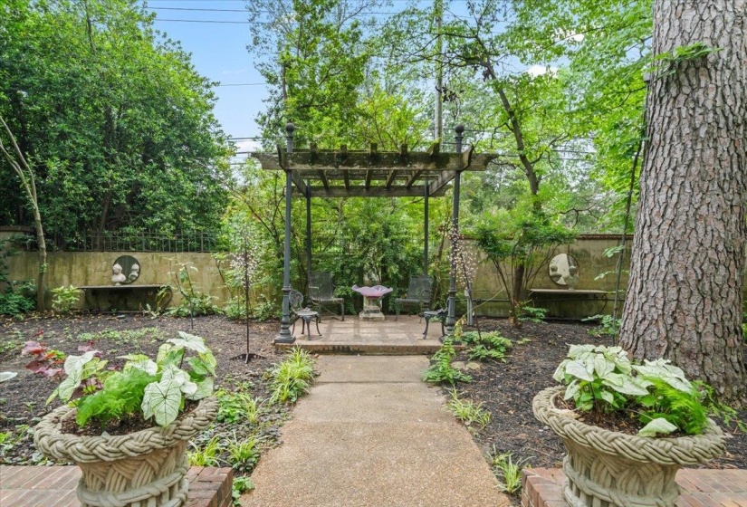 View of yard with fence, a pergola, and a patio area