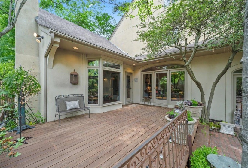 Wooden terrace featuring french doors