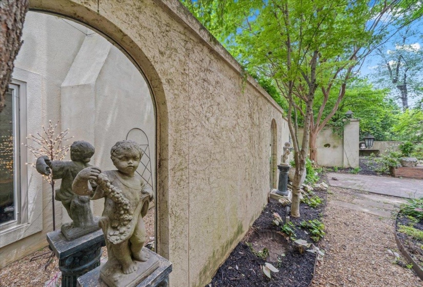 View of side of property featuring fence and stucco siding