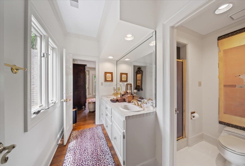 Full bath featuring toilet, vanity, a shower stall, wood finished floors, and recessed lighting