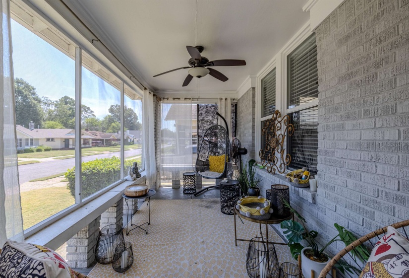 Sunroom featuring ceiling fan