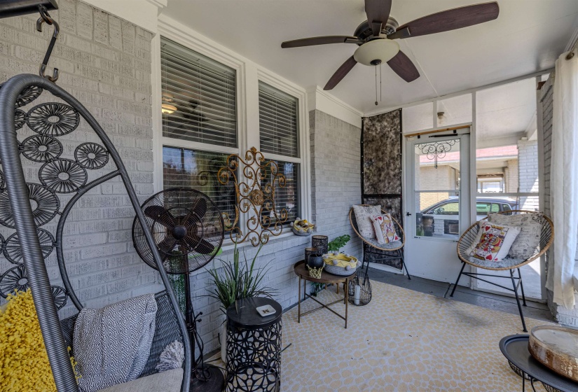 Sunroom / solarium featuring ceiling fan