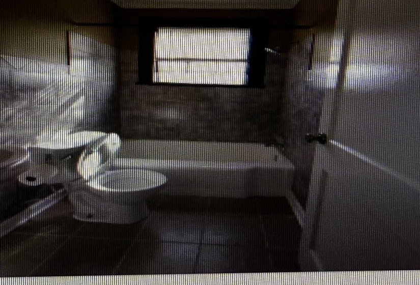 Bathroom featuring toilet and washtub / shower combination