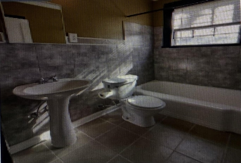 Bathroom featuring toilet and a tile shower